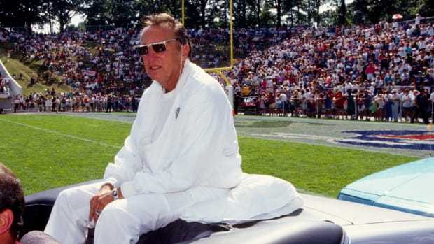 Oakland Raiders owner Al Davis acknowledges fans at the 1992 Hall of Fame game at Fawcett Stadium.